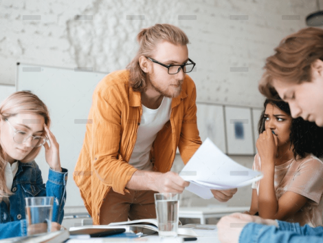 demo-attachment-292-group-of-upset-students-sitting-at-the-table-with-E5YW9L4